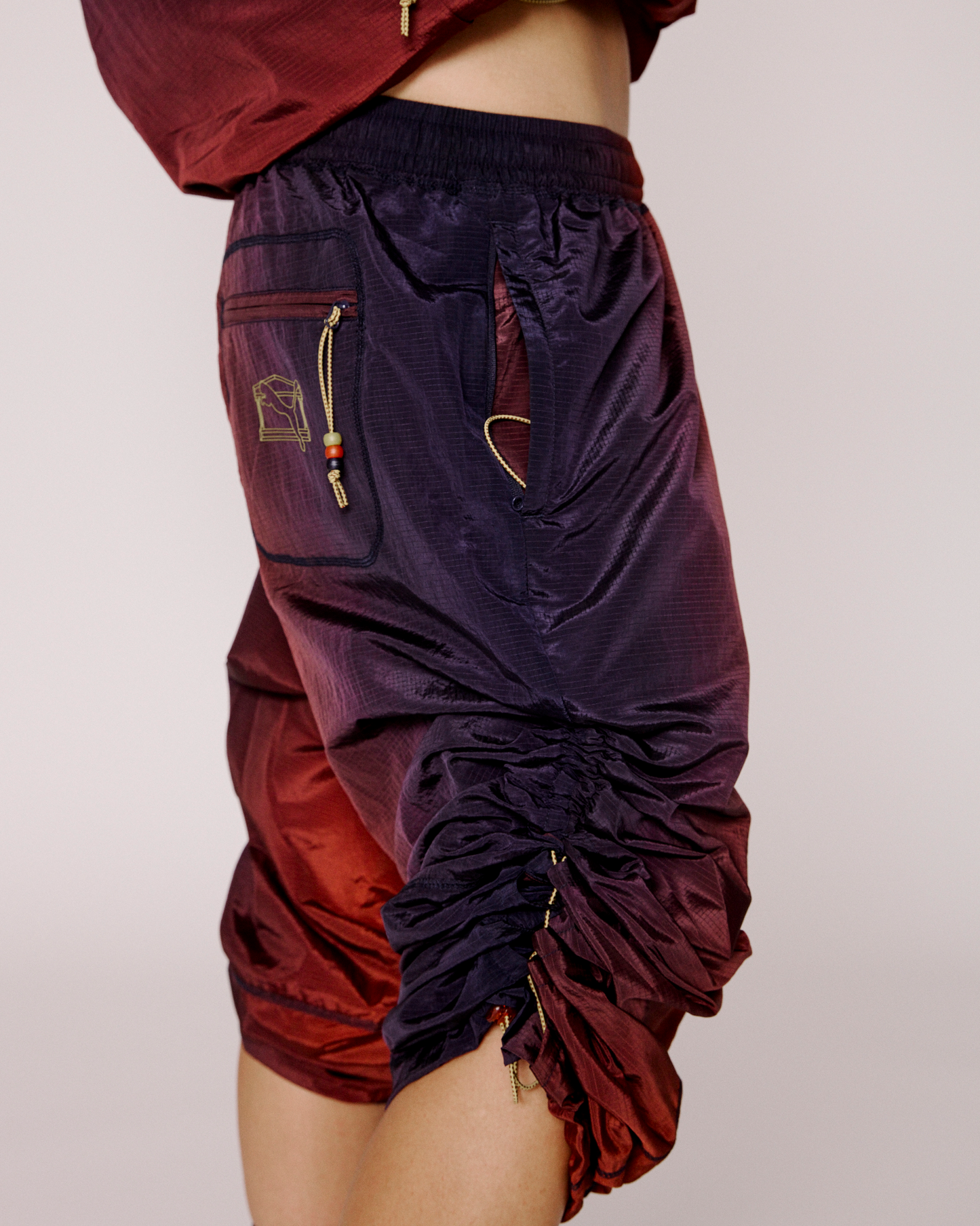 puma x aries ombre nylon laced pants